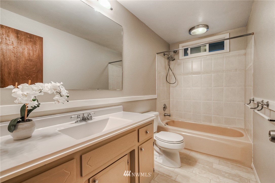 13708 Southeast 141st Street Renton, WA 98059 - Photo 19 of 19 a bathroom with a sink a toilet and shower