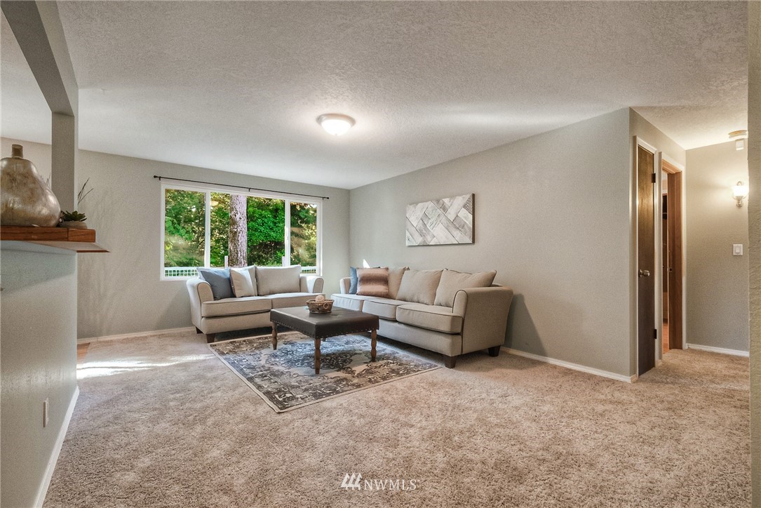 13708 Southeast 141st Street Renton, WA 98059 - Photo 4 of 19 a living room with furniture and a window