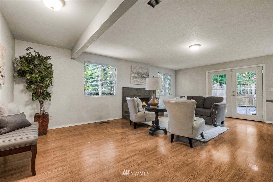 13708 Southeast 141st Street Renton, WA 98059 - Photo 10 of 19 a living room with furniture a window and a potted plant
