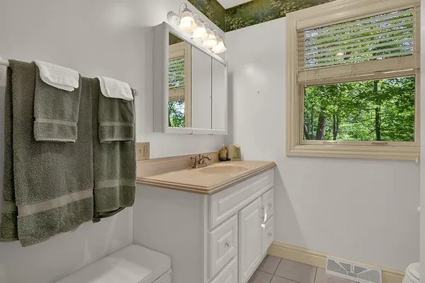 a bathroom with a sink and mirror