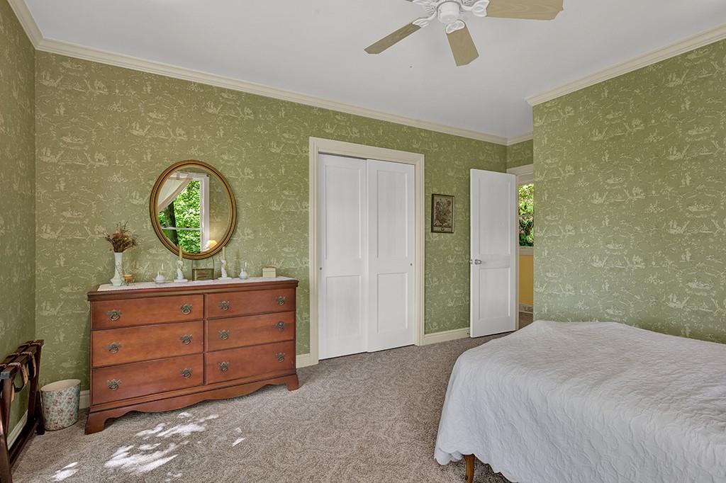 254 Light Lane Ligonier, PA 15658 - Photo 19 of 50 a bedroom with a bed and a chandelier