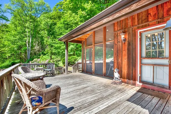a balcony with furniture and garden view