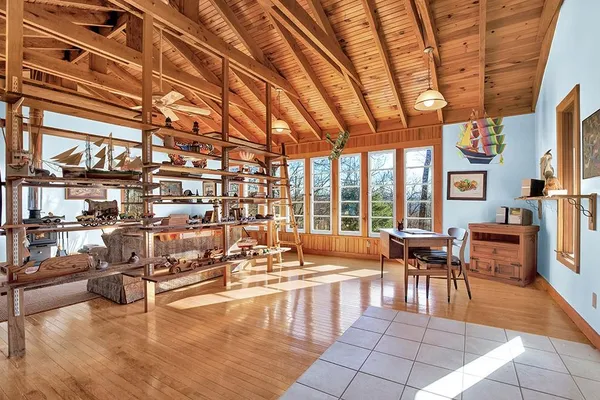 a lobby with furniture and floor to ceiling windows