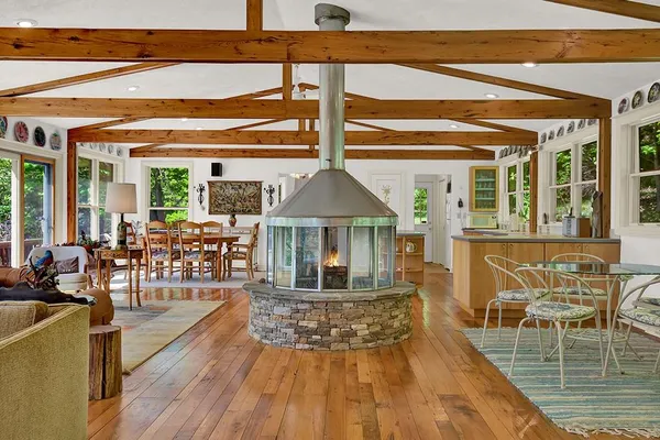 a view of a chairs and table on the wooden floor