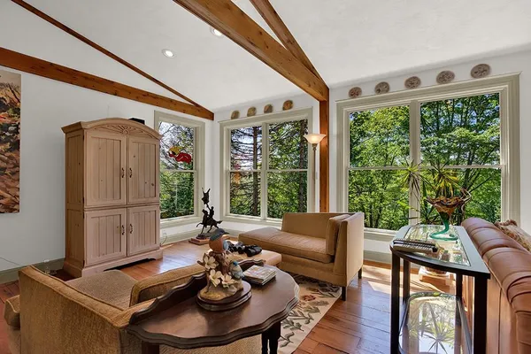 a living room with furniture and a large window
