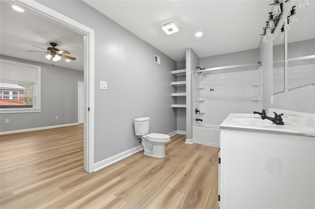 1014 McLaughlin Run Road Bridgeville, PA 15017 - Photo 13 of 25 a bathroom with a sink toilet and shower