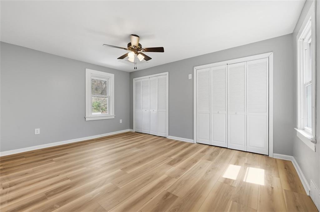 1014 McLaughlin Run Road Bridgeville, PA 15017 - Photo 17 of 25 a view of empty room with wooden floor and fan