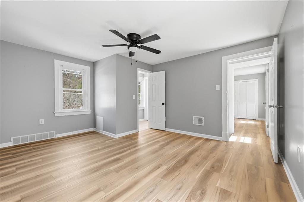 1014 McLaughlin Run Road Bridgeville, PA 15017 - Photo 18 of 25 a view of an empty room with wooden floor and a window