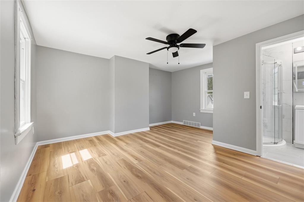 1014 McLaughlin Run Road Bridgeville, PA 15017 - Photo 19 of 25 a view of empty room with wooden floor and fan