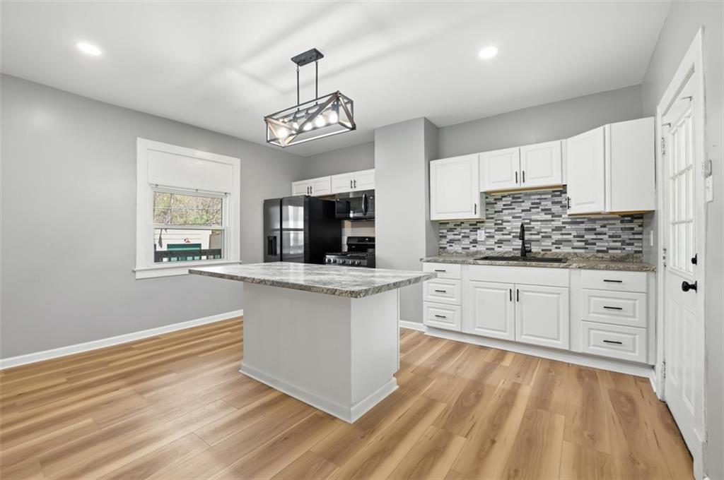 1014 McLaughlin Run Road Bridgeville, PA 15017 - Photo 2 of 25 a large kitchen with cabinets