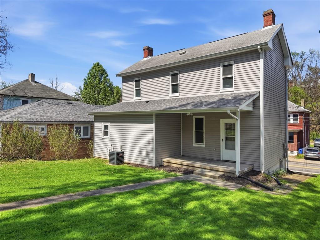 1014 McLaughlin Run Road Bridgeville, PA 15017 - Photo 23 of 25 front view of a house with a yard