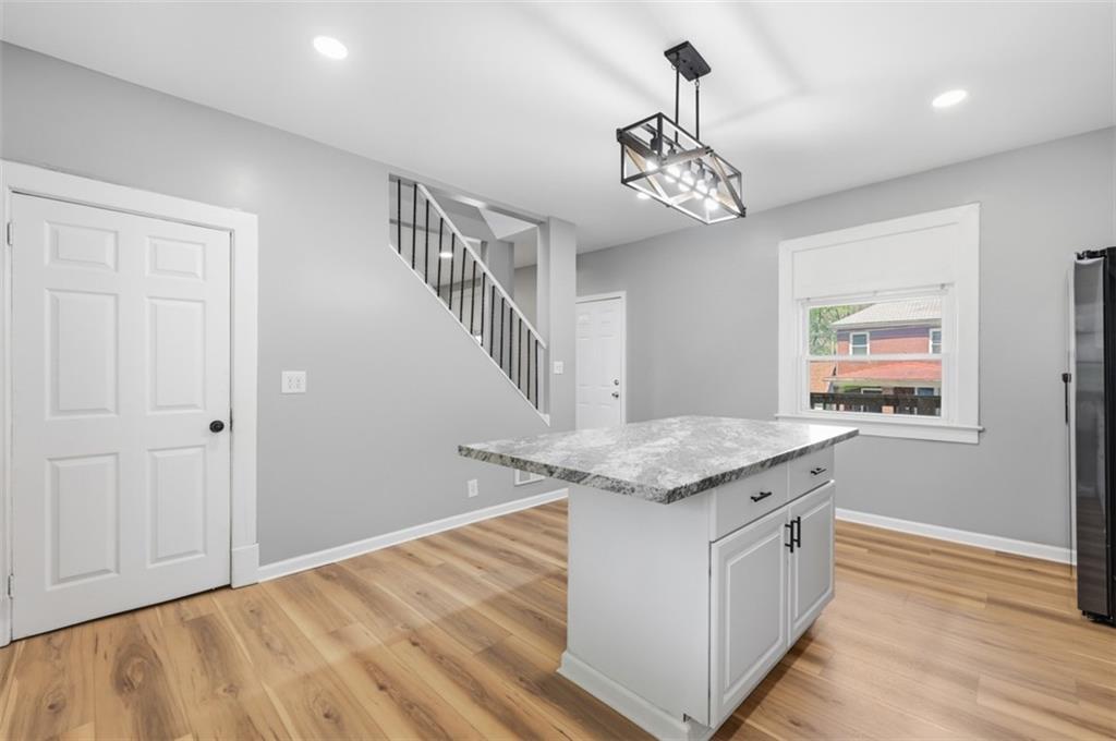 1014 McLaughlin Run Road Bridgeville, PA 15017 - Photo 6 of 25 a view of a kitchen cabinets and wooden floor