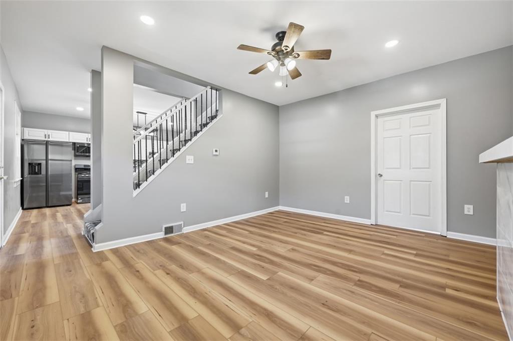 1014 McLaughlin Run Road Bridgeville, PA 15017 - Photo 8 of 25 a view of a room with wooden floor and white walls