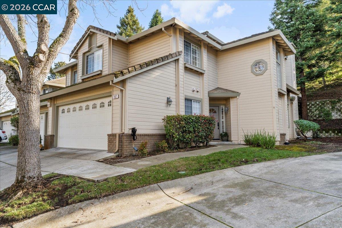 147 Vierra Way Hercules, CA 94547 - Photo 1 of 1 a front view of a house with a yard and garage