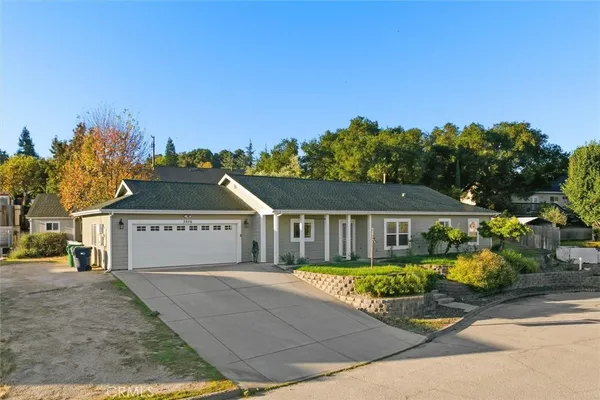 front view of a house with a small yard