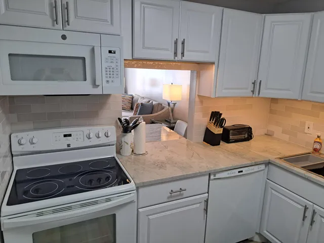 a bedroom with a large bed and a large window