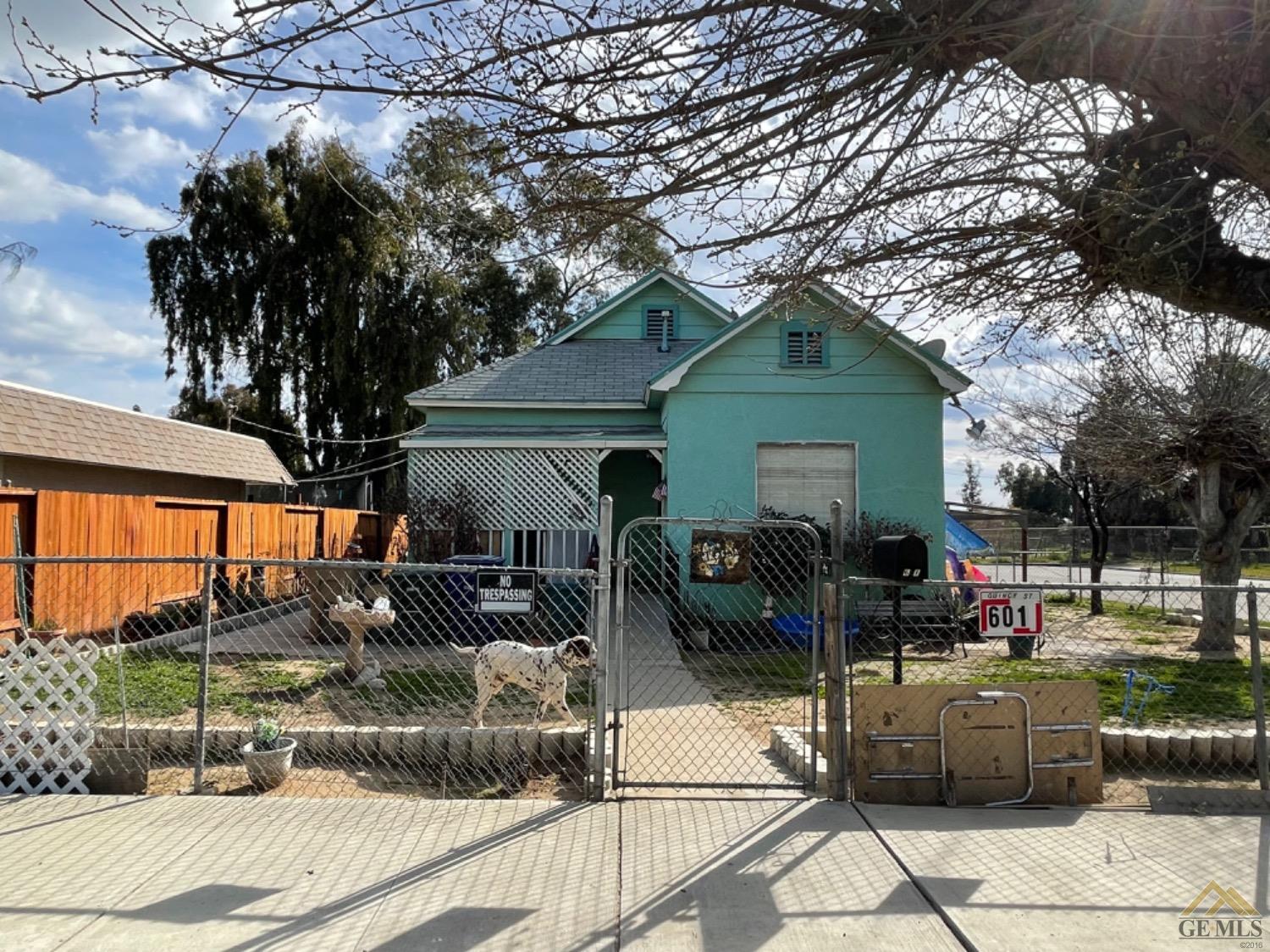 Undisclosed Address Bakersfield, CA 93305 - Photo 1 of 13 a view of a patio with table and chairs potted plants and large tree