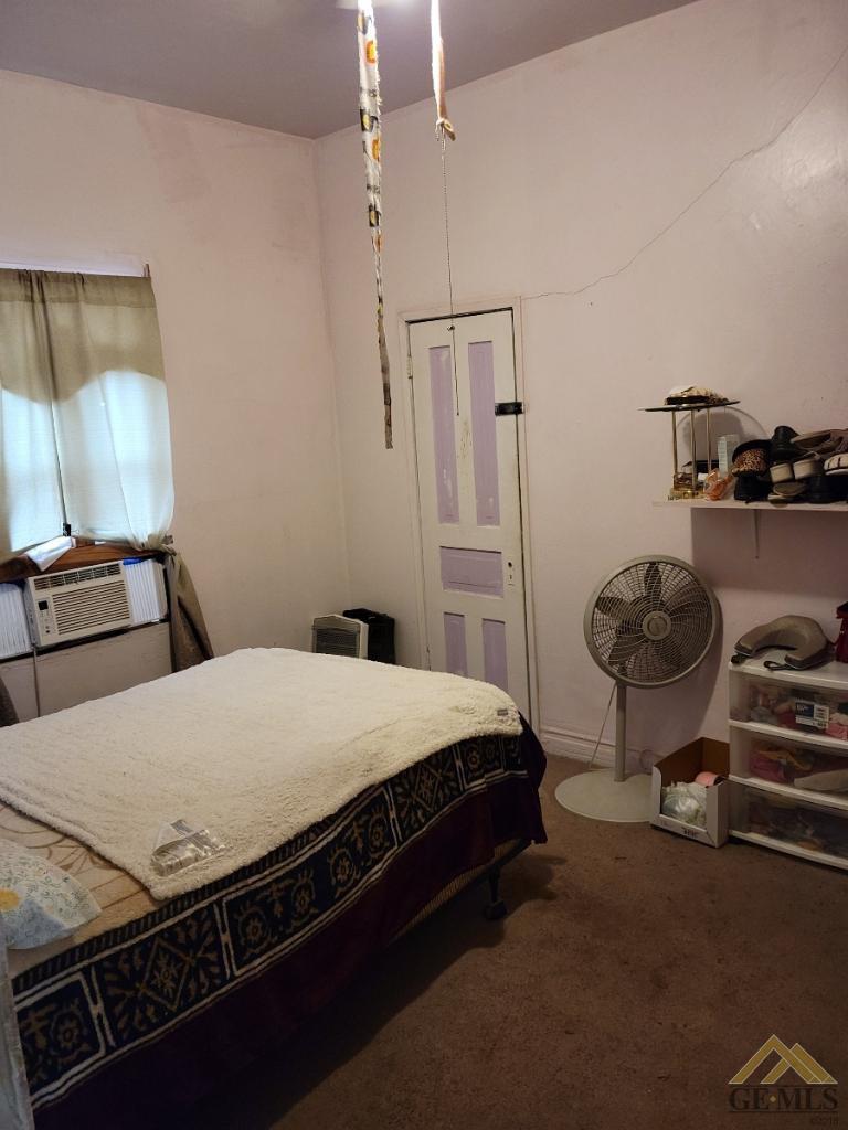 Undisclosed Address Bakersfield, CA 93305 - Photo 11 of 13 a bedroom with bed and cabinets