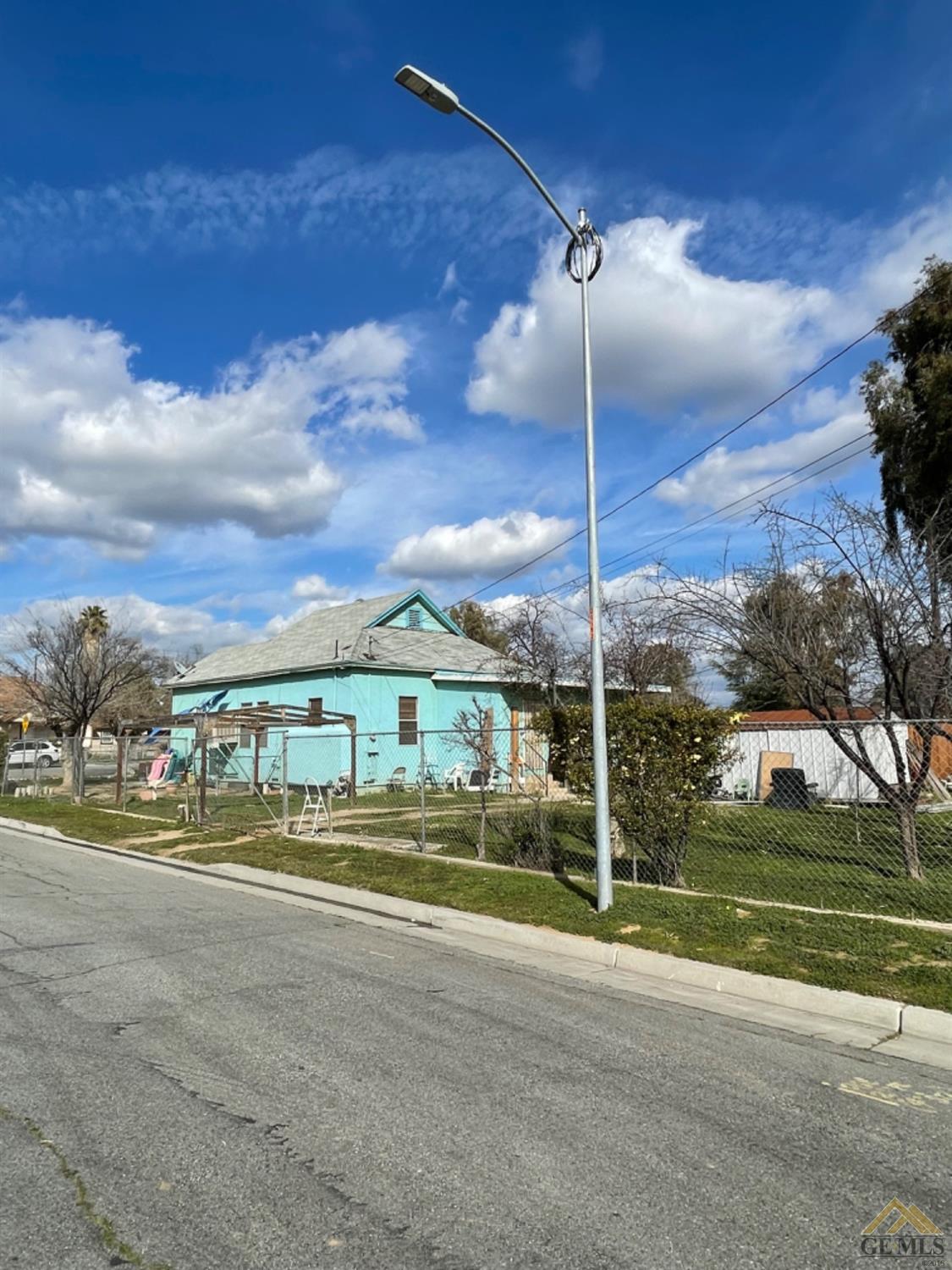 Undisclosed Address Bakersfield, CA 93305 - Photo 3 of 13 a view of a house with a big yard