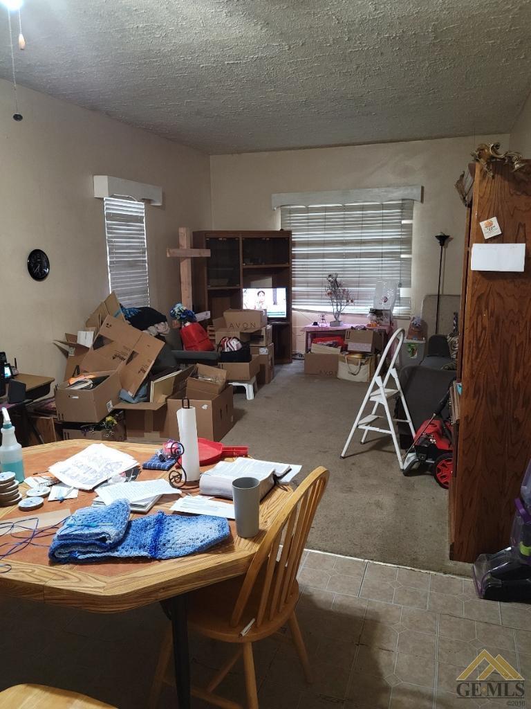 Undisclosed Address Bakersfield, CA 93305 - Photo 5 of 13 a living room with furniture a flat screen tv and a window