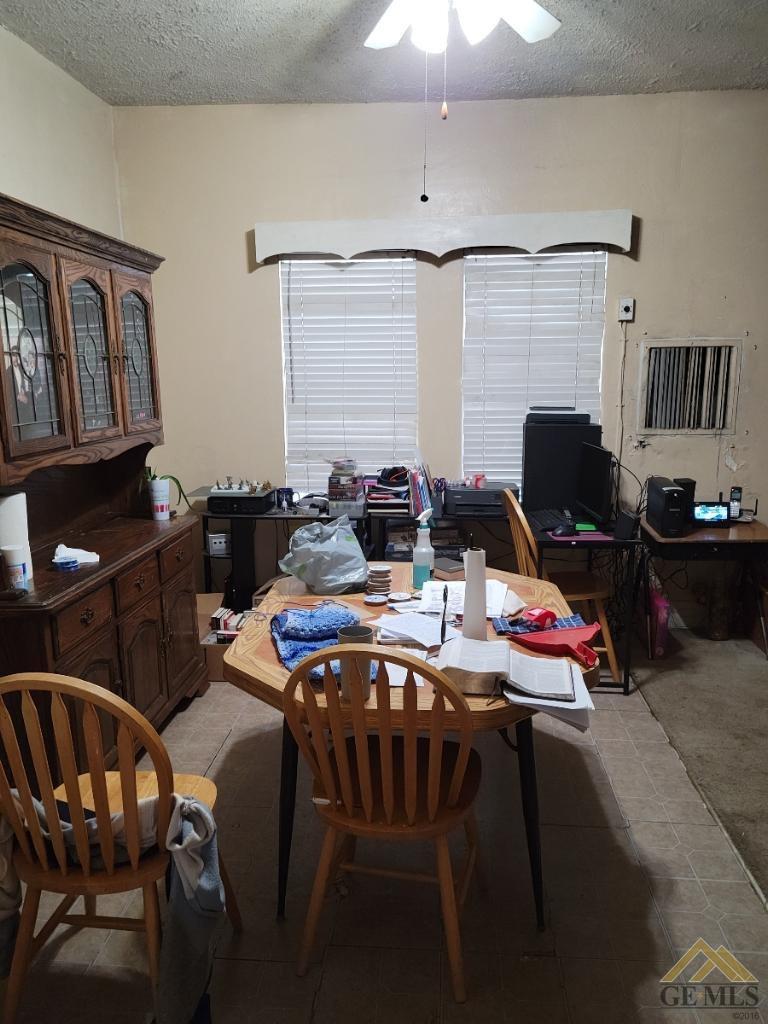 Undisclosed Address Bakersfield, CA 93305 - Photo 6 of 13 a living room with furniture a fireplace and a flat screen tv