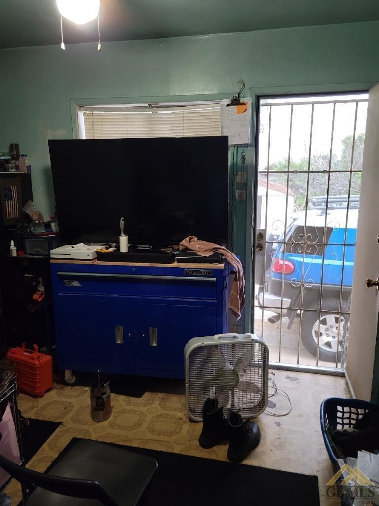 Undisclosed Address Bakersfield, CA 93305 - Photo 10 of 13 a living room with furniture and a fireplace