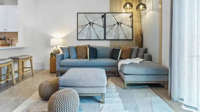 a bedroom with furniture and a large window