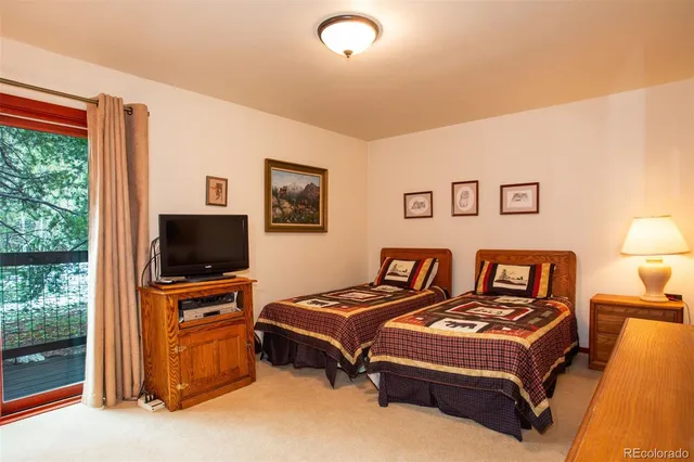 a living room with a couch and a flat screen tv
