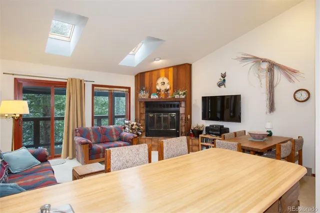 a bedroom with a bed and glass door