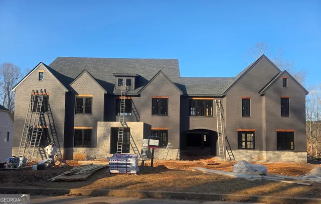a front view of a house with a yard