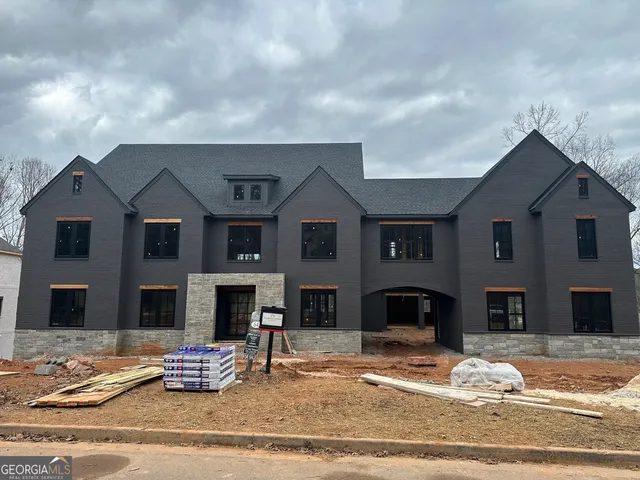 a front view of a house with yard