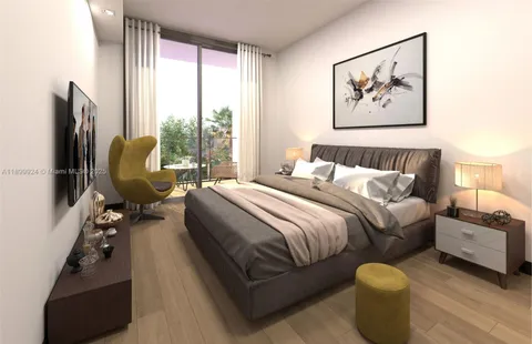 a bedroom with a bed and glass wall