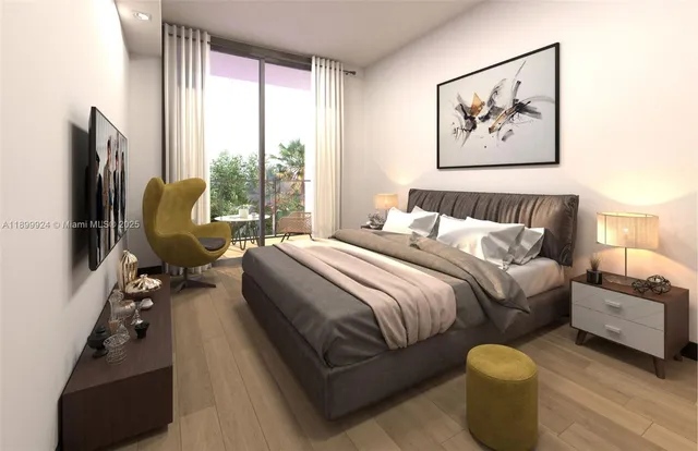 a bedroom with a bed and glass wall