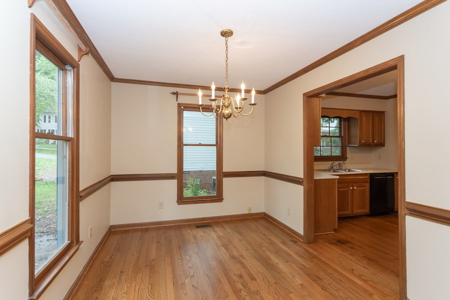 6917 Sandringham Drive Raleigh, NC 27613 - Photo 2 of 25 Spacious dining room with refinished hardwood floors and new paint! Dining Room