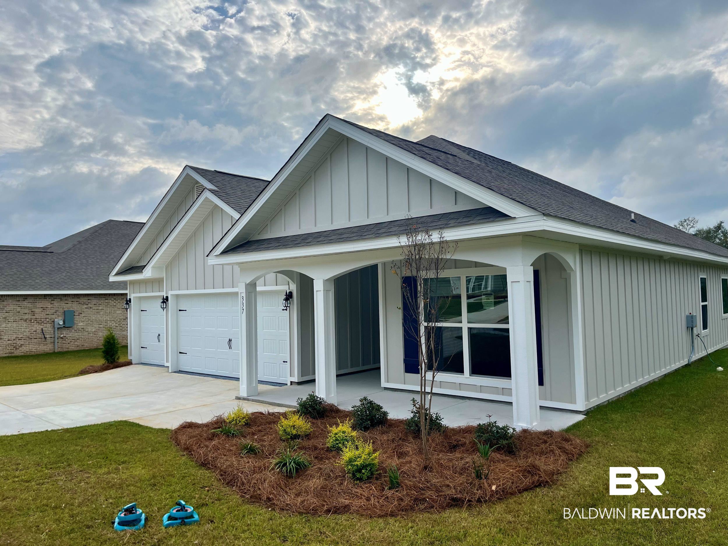 337 Barndling Street Fairhope, AL 36532 - Photo 2 of 34 View of front of home featuring a garage and a front yard