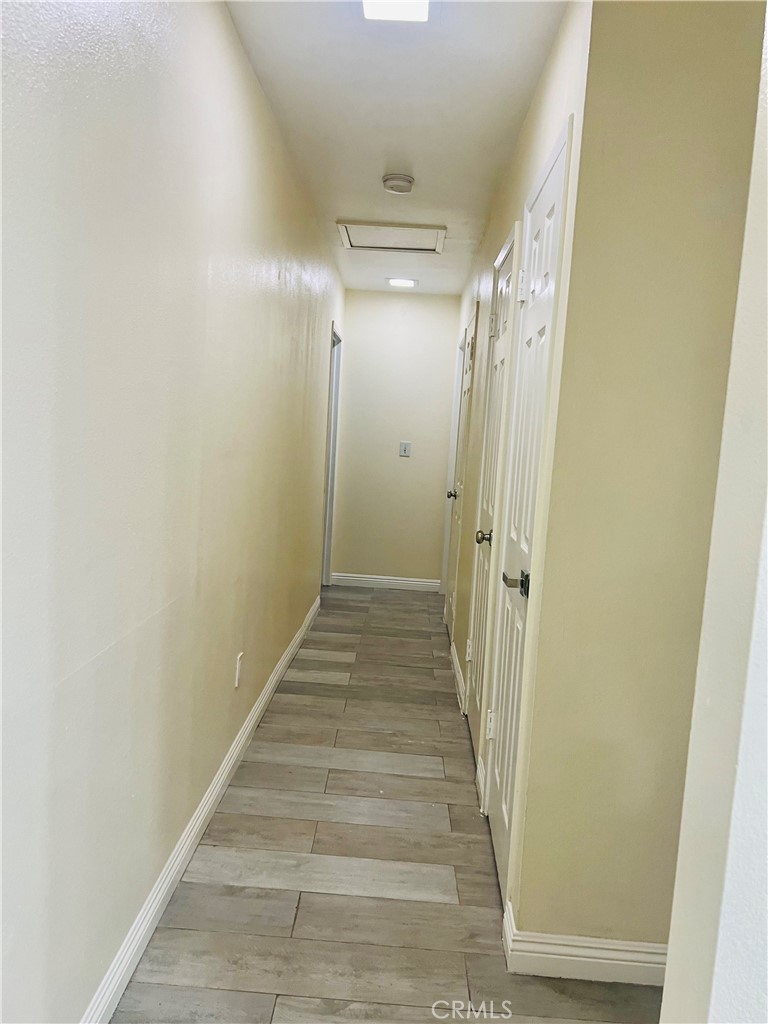 7363 Bothwell Road Reseda, CA 91335 - Photo 25 of 28 a view of a hallway with wooden floor and entryway