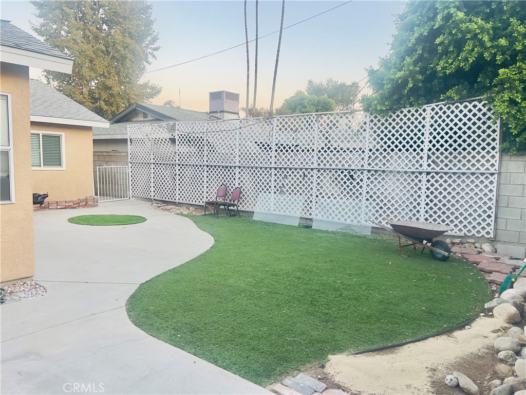 7363 Bothwell Road Reseda, CA 91335 - Photo 3 of 28 a view of a backyard with wooden fence
