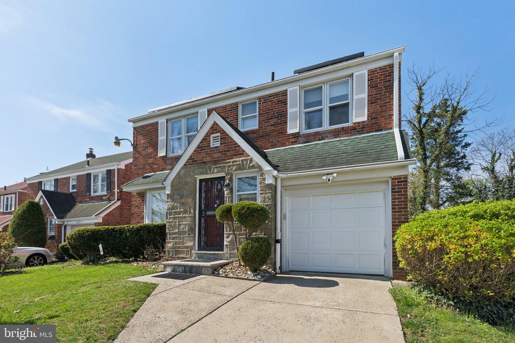 6622 Ardleigh Street Philadelphia, PA 19119 - Photo 1 of 21 Charming brick home with lush greenery.