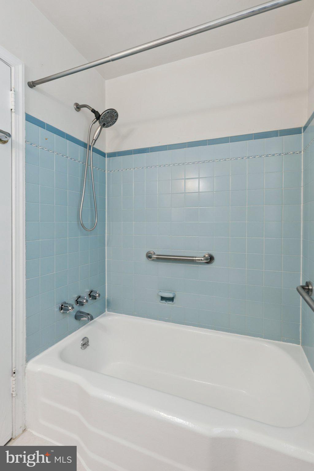 6622 Ardleigh Street Philadelphia, PA 19119 - Photo 19 of 21 Serene blue-tiled bathroom retreat.