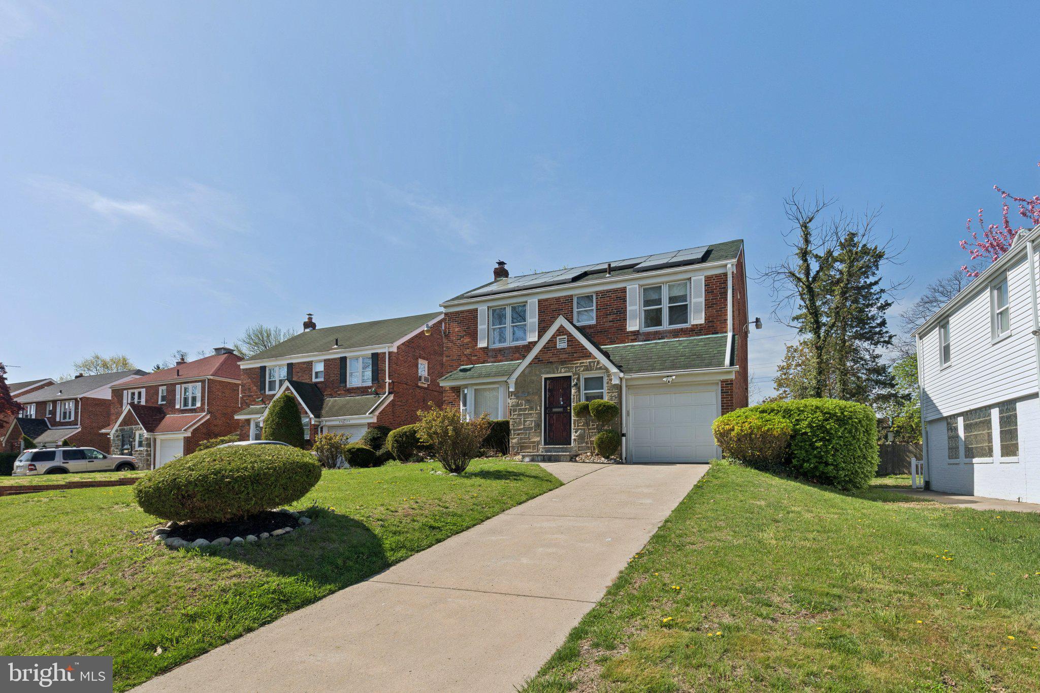 6622 Ardleigh Street Philadelphia, PA 19119 - Photo 2 of 21 Charming brick home with lush greenery.