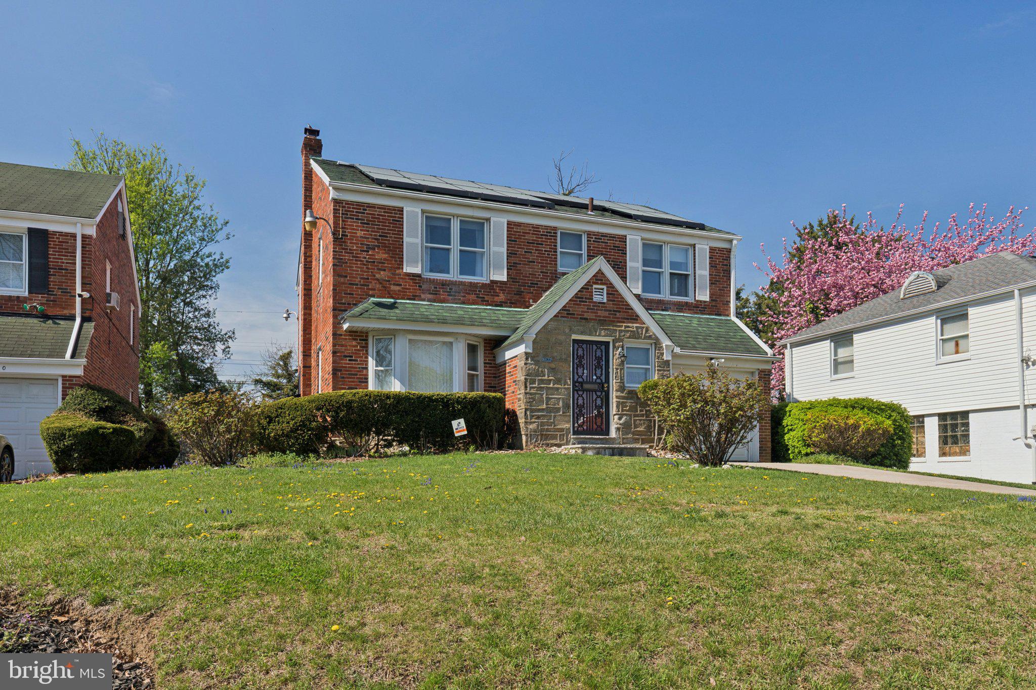 6622 Ardleigh Street Philadelphia, PA 19119 - Photo 4 of 21 Charming brick home with lush greenery.