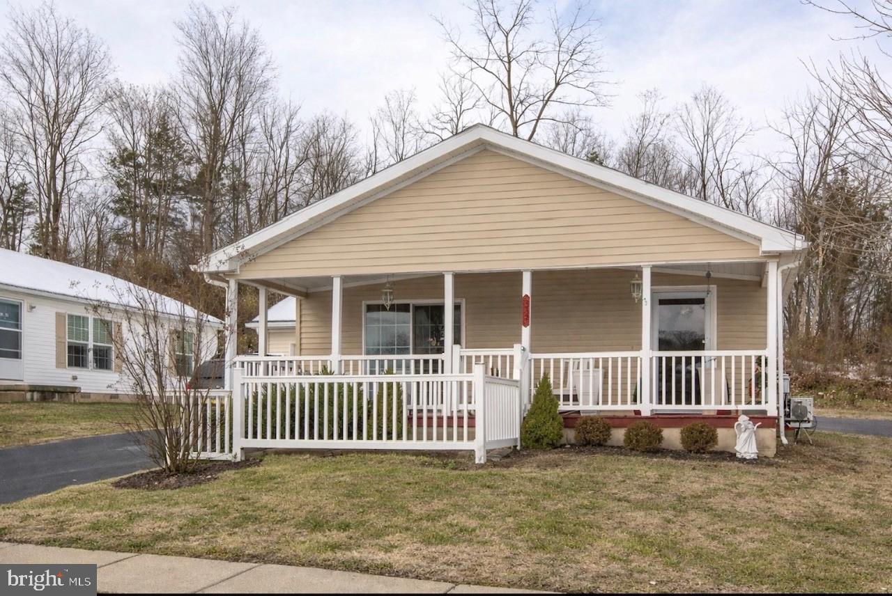 66 Random Road Douglassville, PA 19518 - Photo 2 of 27 a porch with a small yard