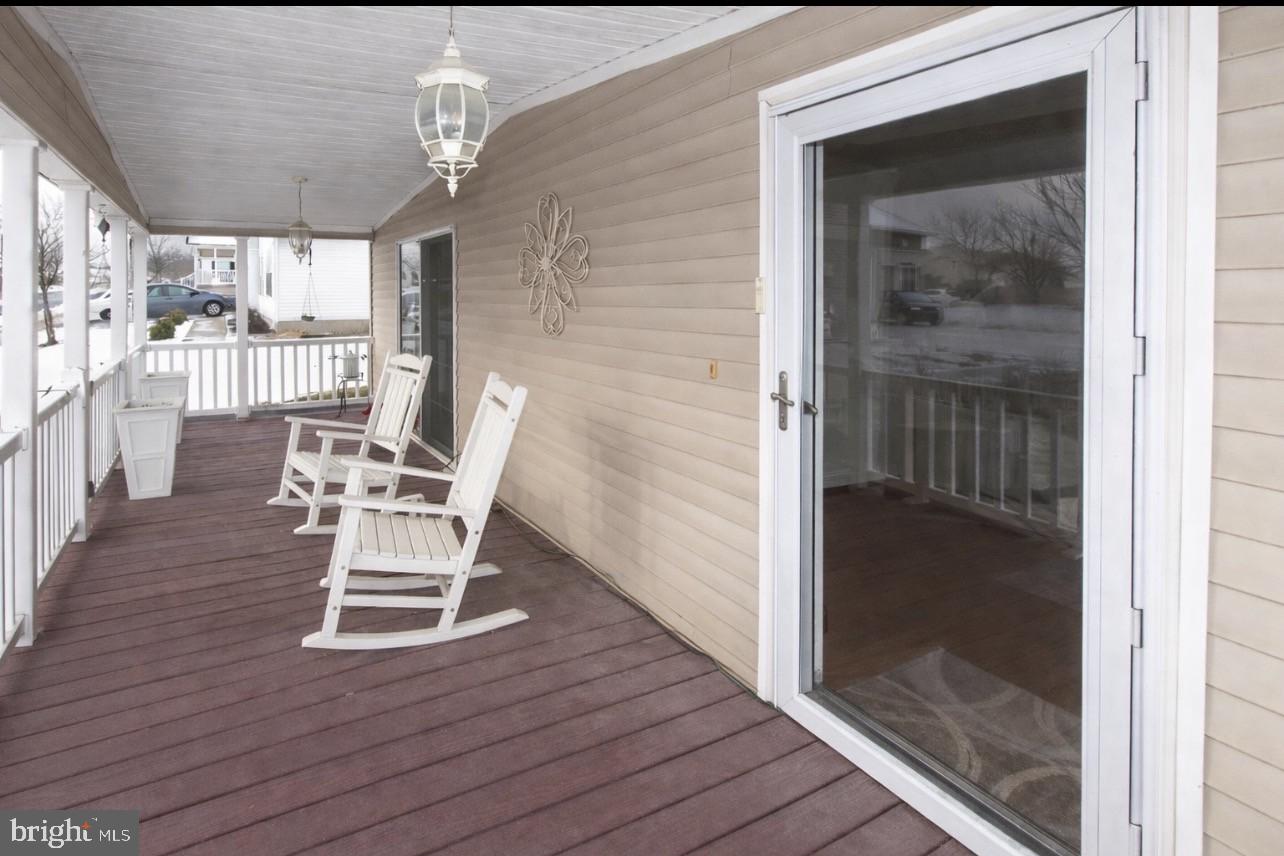 66 Random Road Douglassville, PA 19518 - Photo 21 of 27 a view of a hallway with wooden floor table and chairs