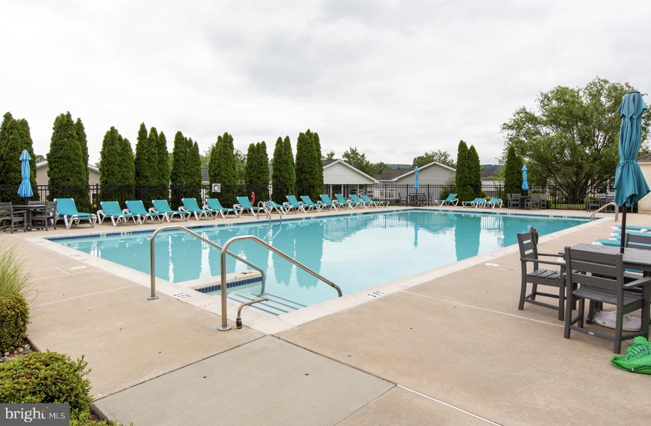 66 Random Road Douglassville, PA 19518 - Photo 25 of 27 a view of a lake with a table and chairs
