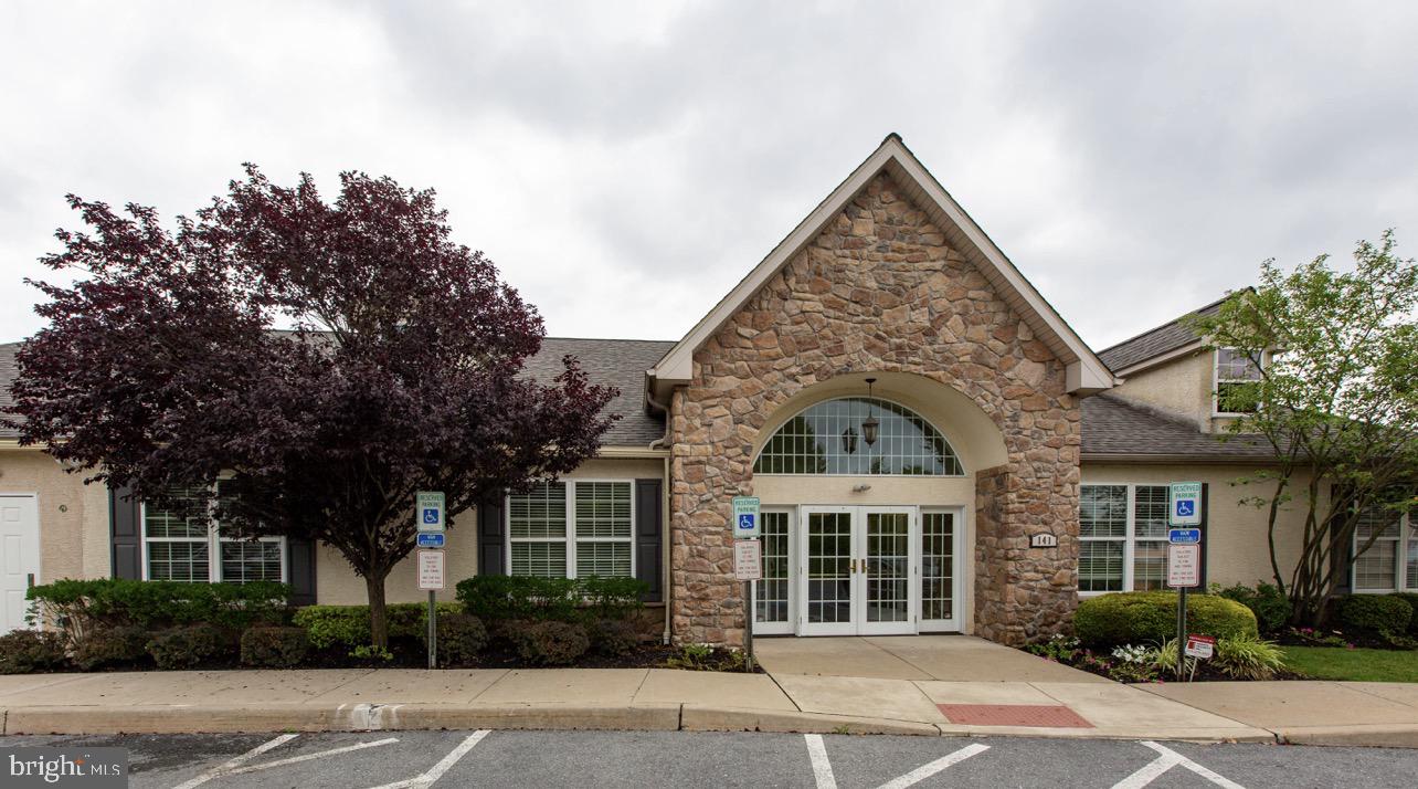 66 Random Road Douglassville, PA 19518 - Photo 26 of 31 a view of a brick house next to a yard