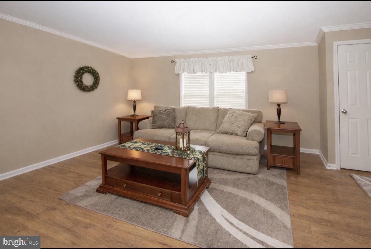 66 Random Road Douglassville, PA 19518 - Photo 4 of 27 a living room with furniture a window and a lamp