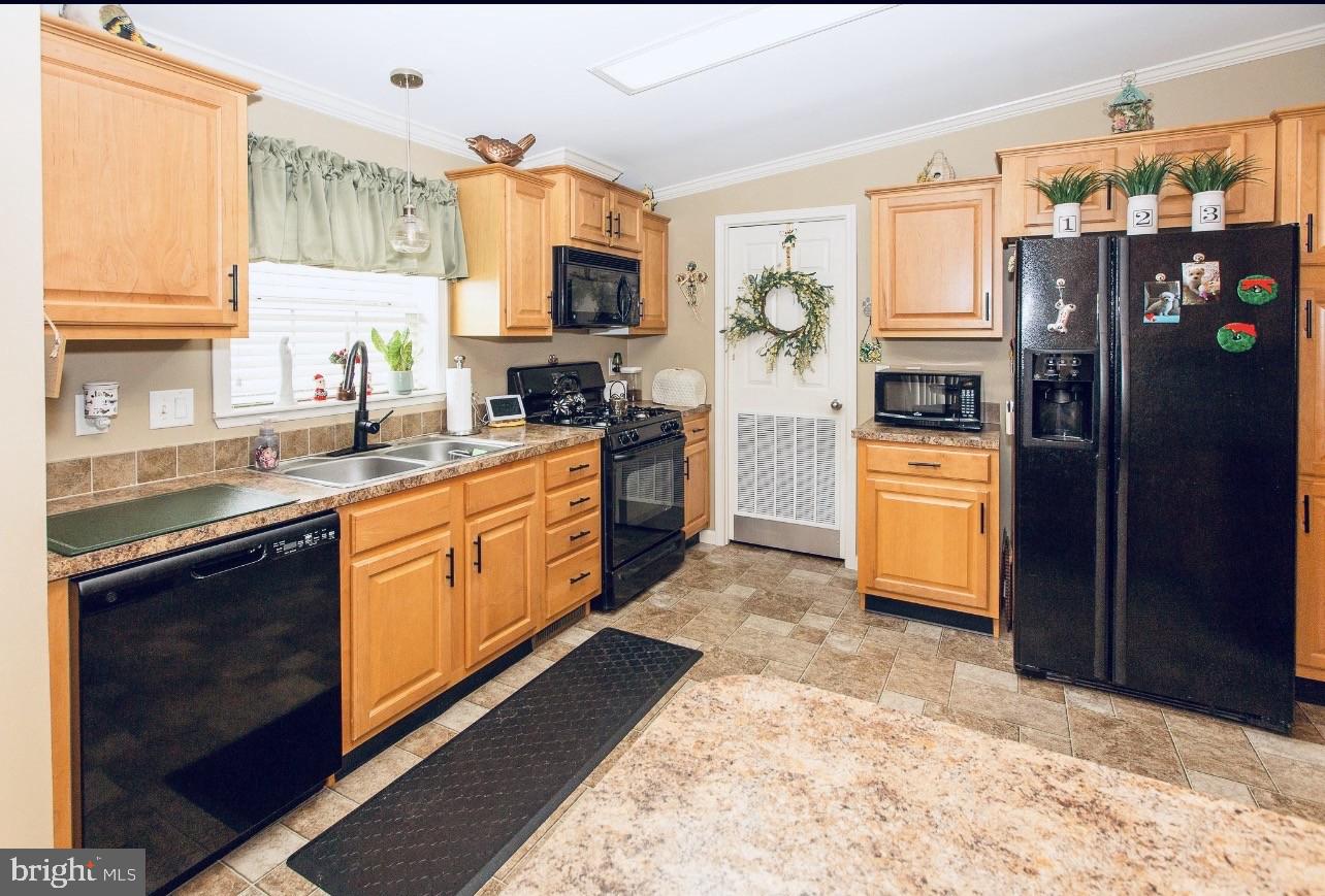 66 Random Road Douglassville, PA 19518 - Photo 9 of 27 a kitchen with stainless steel appliances granite countertop a refrigerator a stove top oven a sink dishwasher and white cabinets with wooden floor