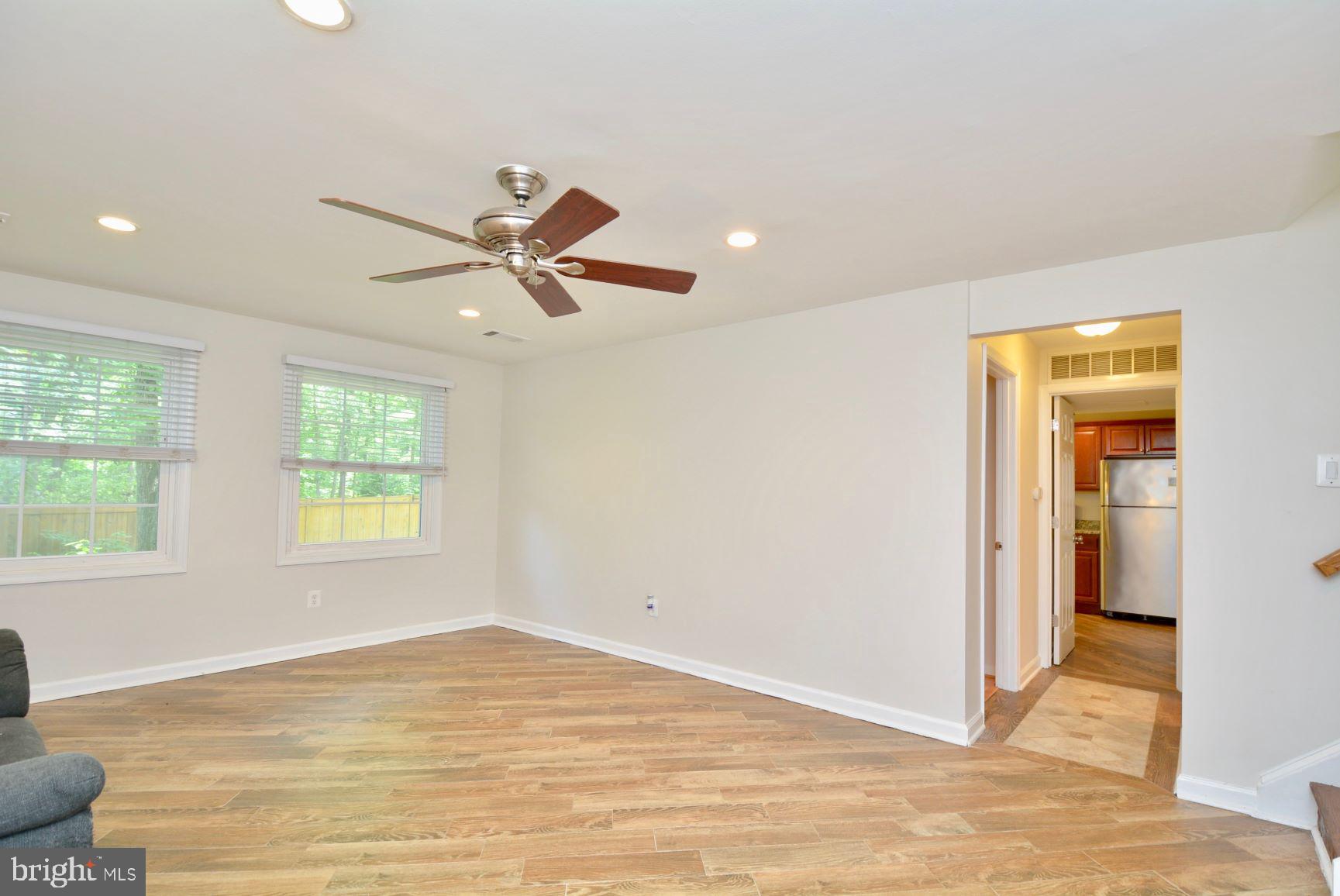 7701 Heming Place Springfield, VA 22151 - Photo 36 of 62 Lower level rec room with hardwood floors