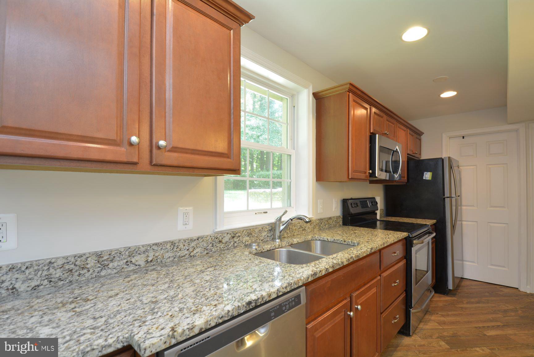 7701 Heming Place Springfield, VA 22151 - Photo 42 of 62 Lower level wet bar area with lots of light.