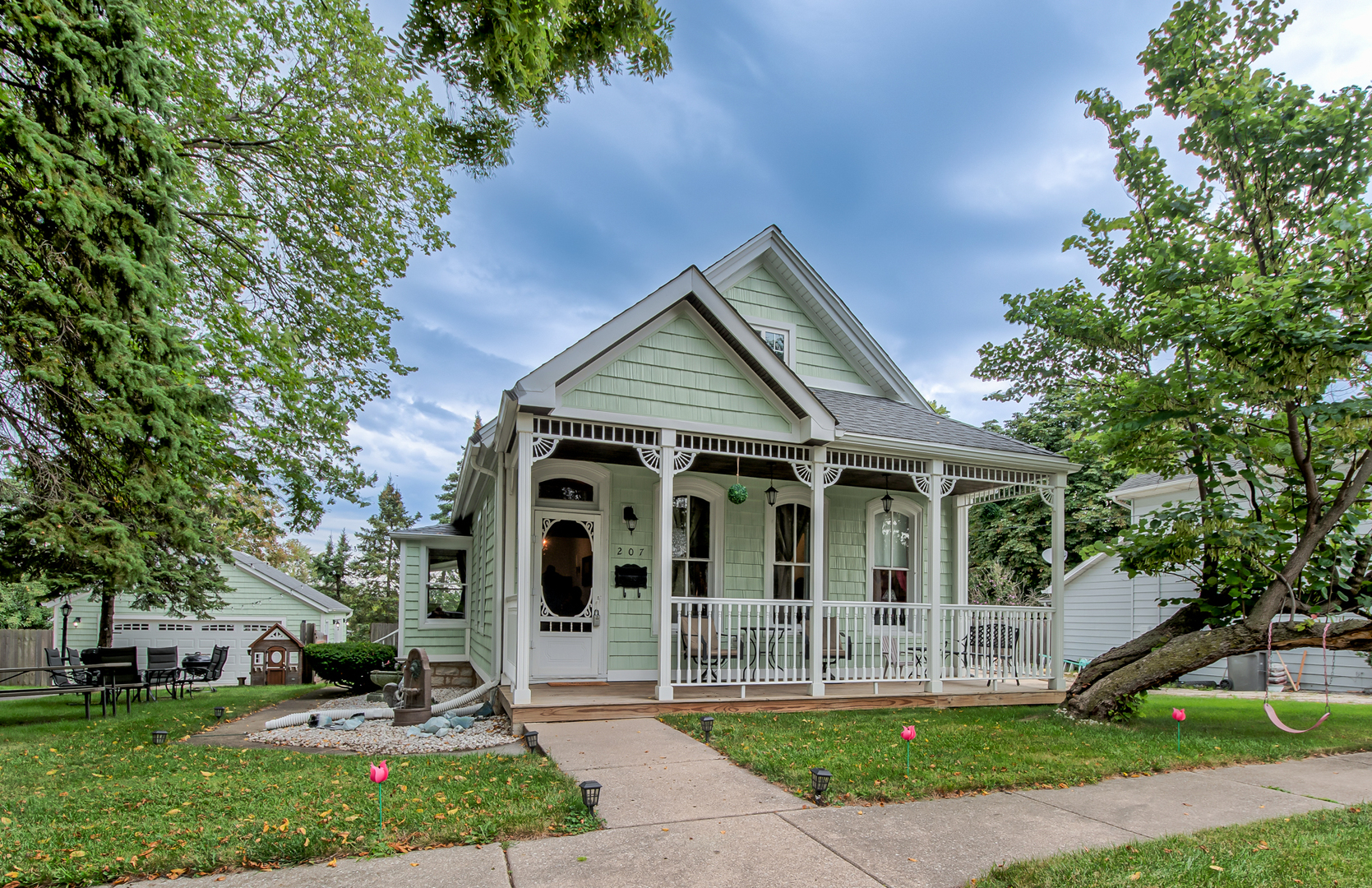 a front view of house with yard and green space